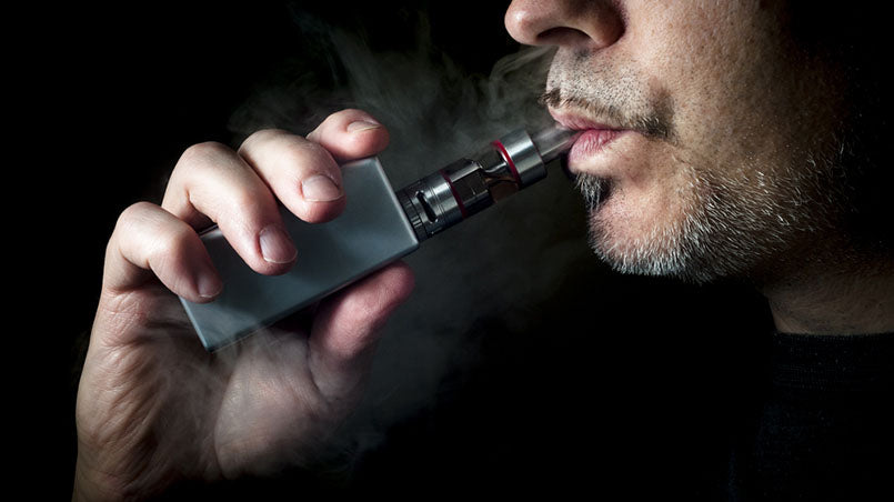 closeup of man vaping